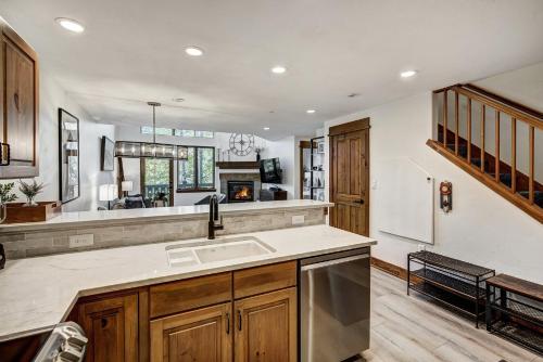 a kitchen with a sink and a counter top at Arrowhead Village, A Vail Resorts Property in Edwards
