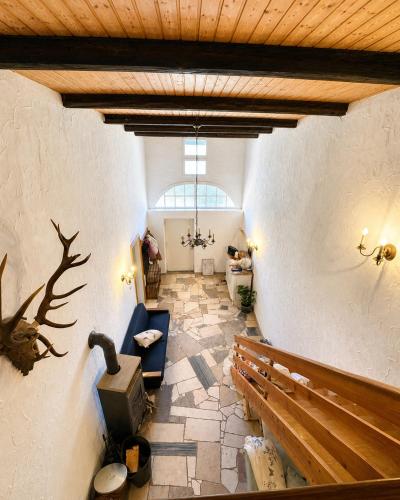a large room with a church with a bench and a church at Anis Obsthof in Bad Arolsen