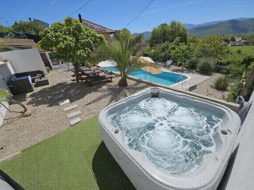 a hot tub on the balcony of a house at Apartment Paz by Interhome in Donji Proložac