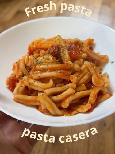a plate of pasta pastaazaaza on a white plate at A casa de Carmen in Sarria
