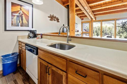 a kitchen with a sink and a window at Evergreen Condominiums by Vail Resorts in Keystone