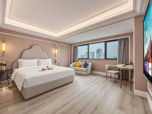 a hotel room with a bed and a television at Mercure Hefei Huaihe Road in Hefei