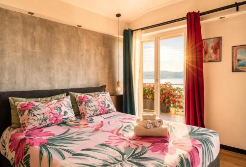 a bedroom with a bed with a teddy bear on it at Open Space Mi Alma Lake View in Toscolano Maderno