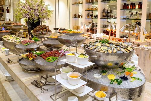 a buffet with many different types of food on display at Caravelle Saigon in Ho Chi Minh City