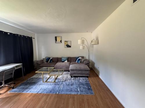 a living room with a couch and a table at Retro lake Eola 1 Bedroom Condo Thornton park in Orlando