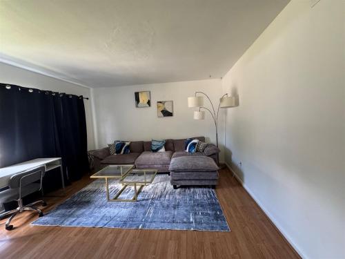 a living room with a couch and a table at Retro lake Eola 1 Bedroom Condo Thornton park in Orlando