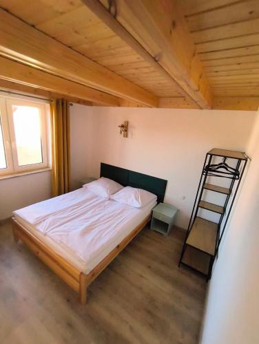 a bedroom with a bed and a ladder in it at Przystanek Borucino in Borucino