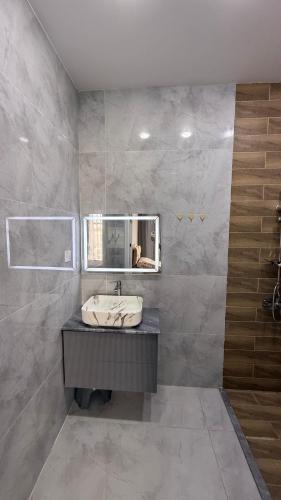 a bathroom with a sink and a mirror at ReVaN in Baku