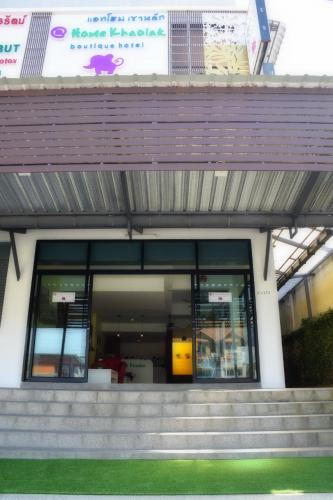 a building with stairs in front of a building at At Home Khaolak in Khao Lak