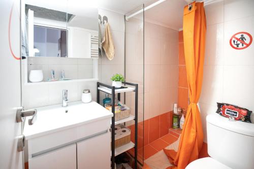 a bathroom with a sink and a toilet and a shower at 7th sky Aristotelous in Thessaloniki