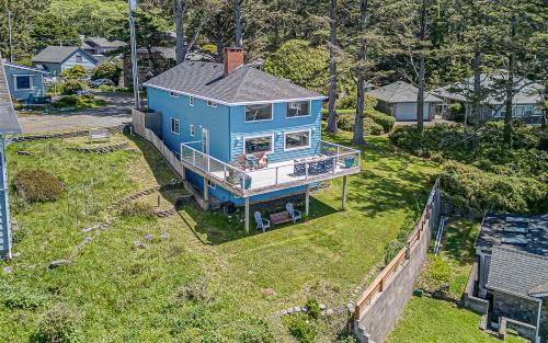 an overhead view of a blue house on a yard at Serendipity -A Happy Surprise Unit B in Oceanside