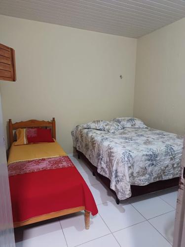 a bedroom with two beds in a room at Casa de Lagoa Nova in Martins