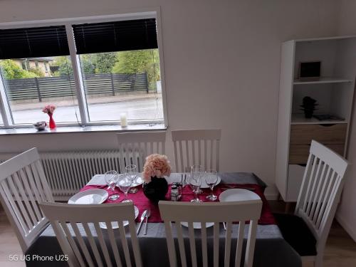 a table with a doll sitting on top of it at Venos Home 2 in Lemvig