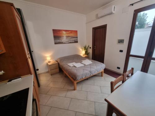 a small bedroom with a bed in a room at Red Rose Tiburtina in Rome
