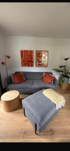 a living room with a couch and a table at Alpensegler in Mittenwald