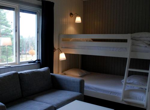 Säng eller sängar i ett rum på Hotell Moskogen