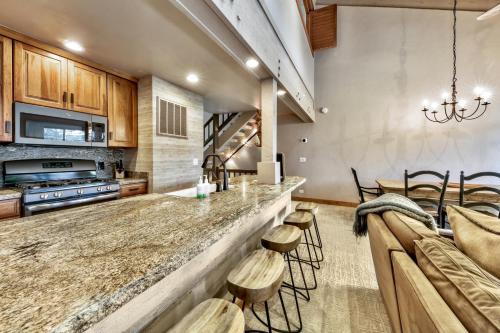 a kitchen with a counter and a bar with stools at Lakeland Village #476 in South Lake Tahoe