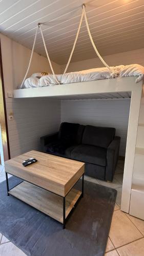 a living room with a couch and a coffee table at Peace's House, Studio moderne, Bas-du-Fort, Plage à pied, Parking privé in Le Gosier