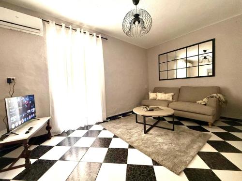 a living room with a couch and a table at Casa Mirador in Loja