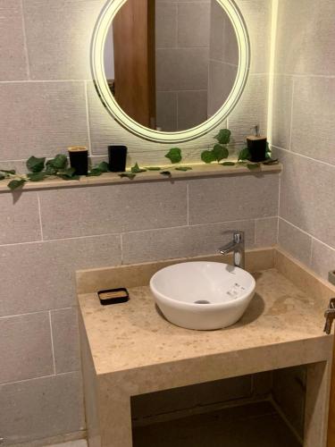 a bathroom with a sink and a mirror at Arwaa Boutique in Dahab