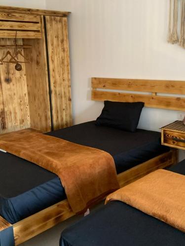 two beds sitting next to each other in a room at Arwaa Boutique in Dahab