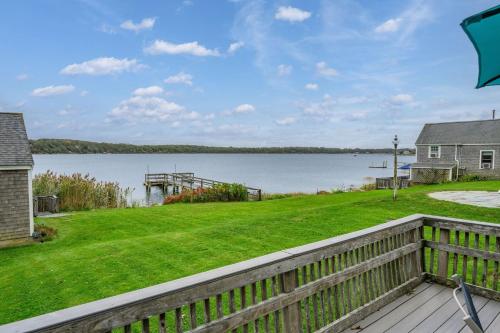 a view of the water from the deck of a house at Tranquil Eastham Waterfront Cottage Escape in Eastham