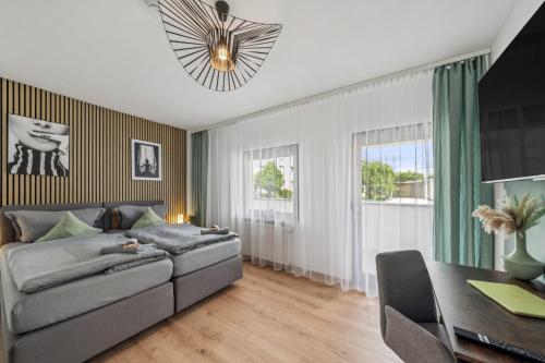 a living room with a couch and a table at SleepHaven in Walldürn