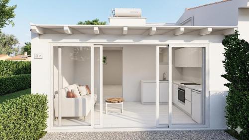 a garden pavilion with a couch and a table at Village & Camping La Foce in Valledoria