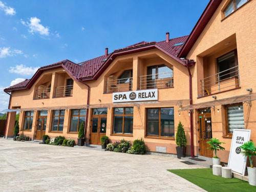 a building with a sign that reads spa and heal at HotelVizit in Solotvyno