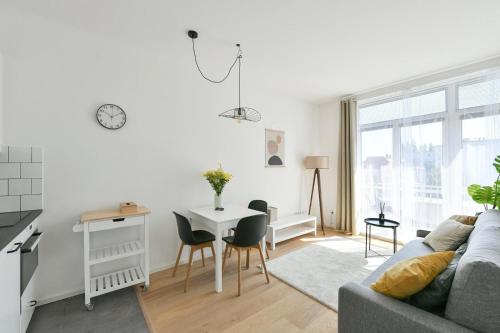 a living room with a couch and a table at Apartmán Kolonáda in Poděbrady