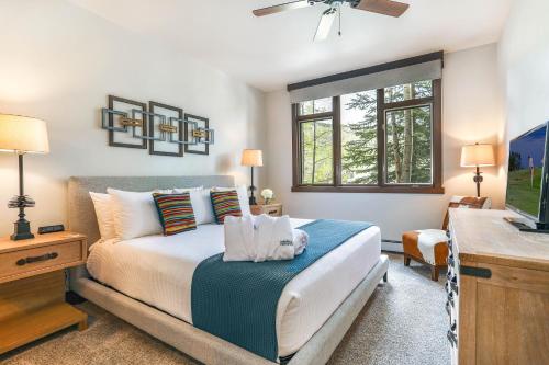 a bedroom with a bed and a television in it at 104 Highlands Westview in Avon