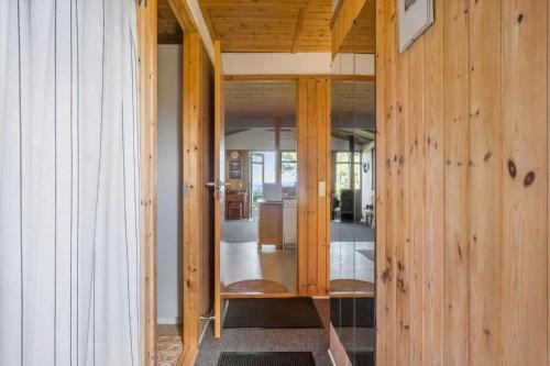 a room with wooden walls and a hallway with glass doors at FY418-Faaborg-Fruerlund-48 in Faaborg