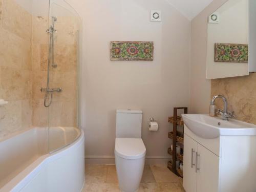 a bathroom with a toilet and a sink at The Granary in York