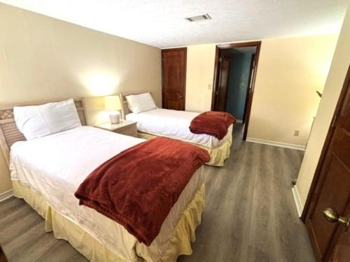 a hotel room with two beds in a room at Royal Holiday Beach Resort in Biloxi