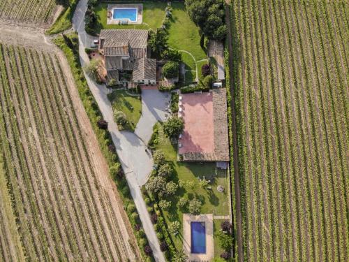 an aerial view of a house in a field at Masia Olivera in Sant Pau dʼOrdal