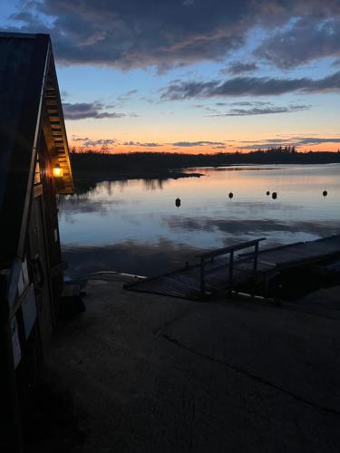 a view of a body of water at sunset at Sandvik Gästhamn & Camping in Kökar