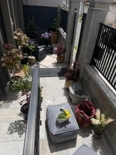 a balcony with a bowl of vegetables on a table at Liams Cozy Villa in Korçë