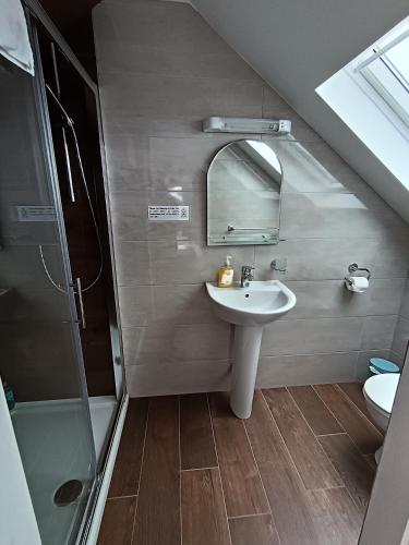 a bathroom with a sink and a mirror at Radharc soiléir in Doolin