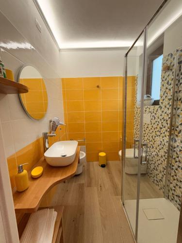 a bathroom with a sink and a shower at Agriturismo Adenzia in Porto Empedocle