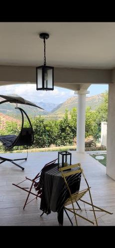 a large room with a view of a mountain at Chambre de charme Andria jacuzzi in Patrimonio