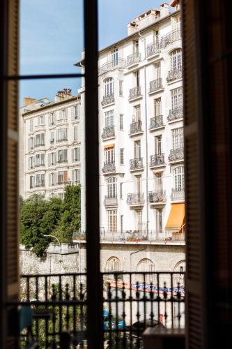 a view of a large white building from a window at Simple Stay - Fresh Start May 2026 in Nice