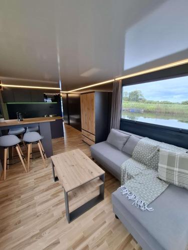 a living room with a couch and a table at Aquastay Drift in Athlone