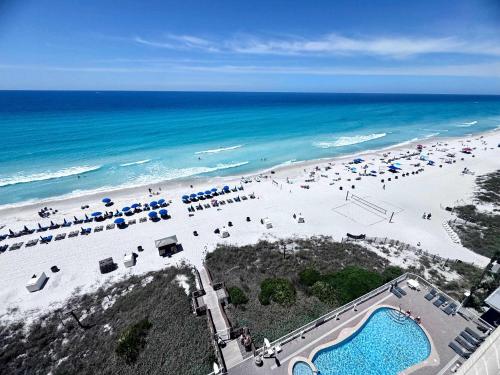 an aerial view of a beach with umbrellas and chairs at 2 BR Oceanfront Condo with Shared Pool & Hot Tub in Panama City Beach