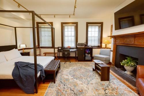 a bedroom with a bed and a fireplace at The Graham Georgetown in Washington, D.C.