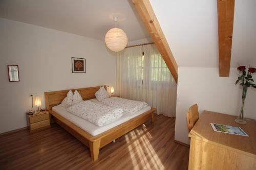 A bed or beds in a room at Apartments Im Winkl
