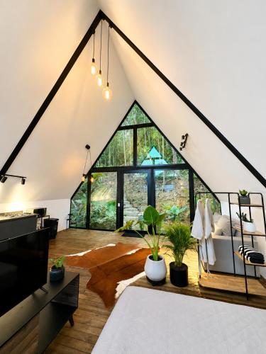 an attic living room with a large window at Private Luxury A-Frame with Jacuzzi & Mountain View in San Francisco