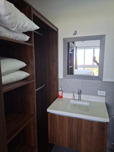 a bathroom with a sink and a mirror at Venice House, Costa del Sol in San Luis La Herradura