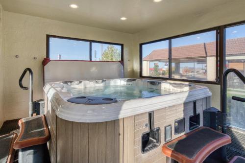 a large hot tub in a room with windows at Best Western Foothills Inn in Mountain Home