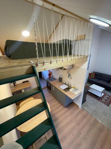 a room with two bunk beds and a desk at Studio Juncalinho - Stylish Portuguese Studio in São Teotónio