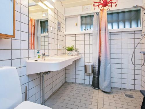 a bathroom with a sink and a shower at Coastal Bungalows with Beach Access in Karrebæksminde